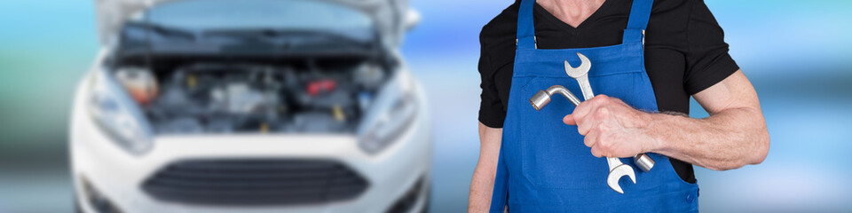 Plakat Car mechanic holding wrenchs