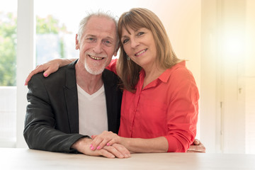 Portrait of a happy senior couple, light effect