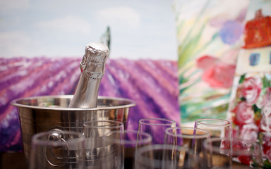 glasses of champagne and a bottle of champagne standing on the table