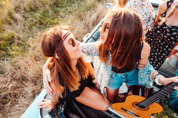 Girls in a cabriolet posing on the camera