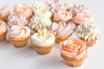 Obraz na płótnie Canvas Cupcakes With Buttercream Flower Toppers