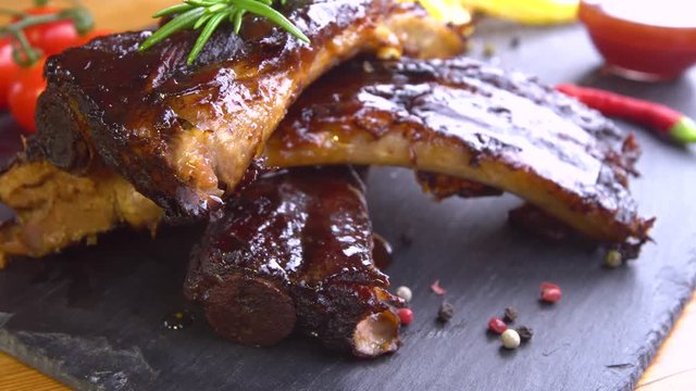 grilled bbq ribs on stone plate
