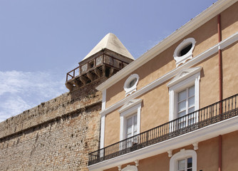 Fototapeta premium View of historical building and wall of fortress in Ibiza.
