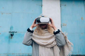 Girl in the street with a vr glasses