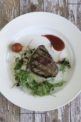 Grilled steak fillet with garnish