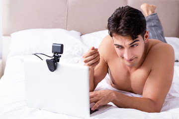 Young sexy man in online dating concept