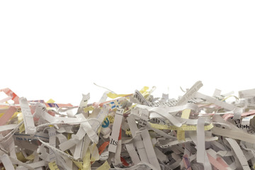 Shredded documents, pile of paper over white background