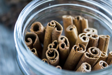Cinnamon sticks in a can, christmas background
