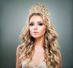 Perfect Blonde Woman with Golden Tiara on her Head. Glorious Model with Diamonds Jewelry, Wavy...