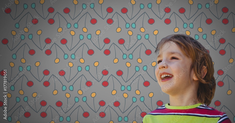 Poster boy against grey background happy and colorful pattern