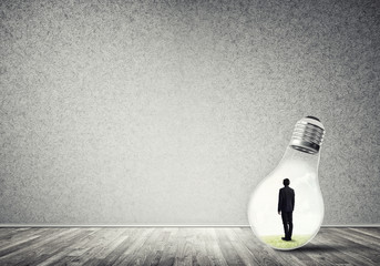 Businessman trapped in bulb