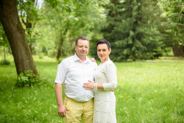 Portrait Of Happy Family In Garden