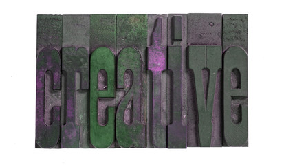 Creative spelled out in vintage wood type letters isolated on white