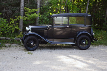 Antique auto on a country lane
