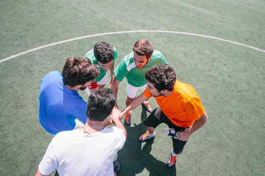 Soccer players giving encouragement themselves before a soccer match