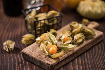 Physalis fruits on wooden board