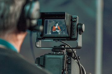 Cameraman shooting in studio close-up