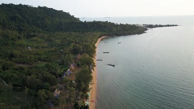 High altitude aerial camera pushes in showing an island paradise of Rabbit Island, Cambodia.