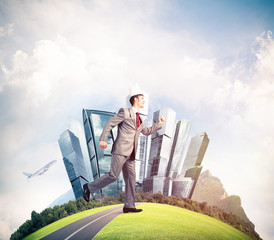King businessman in elegant suit running on green globe with mod