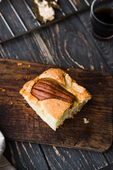 Pear seasonal cake slice dark rustic wooden table. Food photography concept