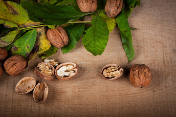Walnuts (Juglans regia) on a wooden table