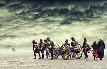 Napoleon soldiers marching in open land with dramatic sky above. The Battle of the Three Emperors....