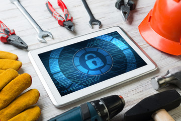 Web security and technology concept with tablet pc on wooden table © adam121