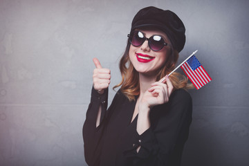 girl with flag of USA on grey background