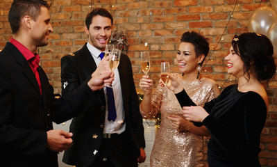 Happy beautiful couples celebrating Christmas