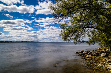 St. Lawrence River, rocky coastline and blue sky