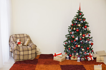 Christmas tree on new year's Eve in a white room with Christmas gifts