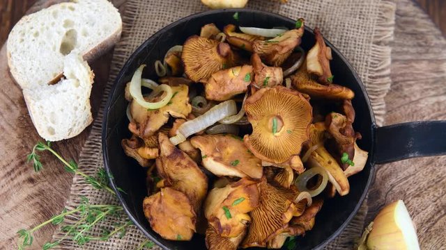 Portion of rotating fried Chanterelles (in a pan) as 4K UHD footage (not loopable)