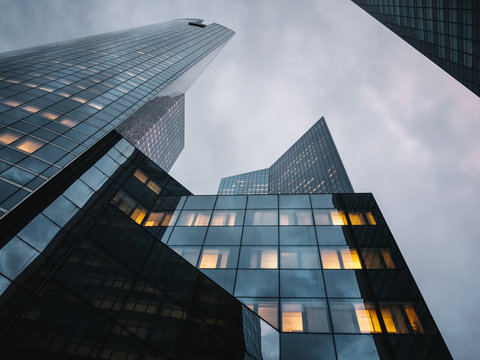 Illuminated office windows in contemporary building at twilight