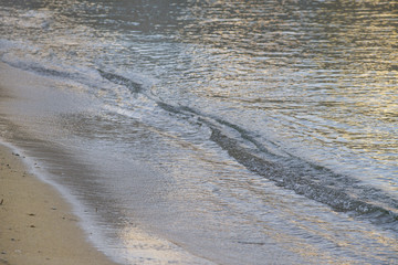 Beach at dawn with small waves