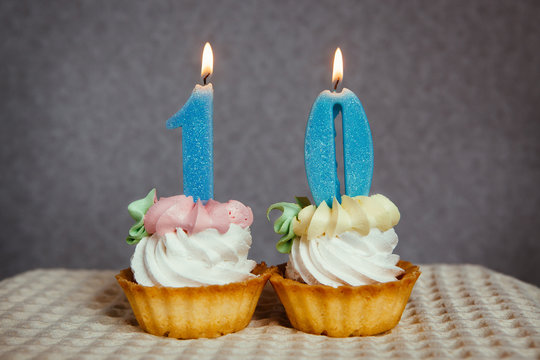 Happy 10 birthday cakes and blue number candles, anniversary concept