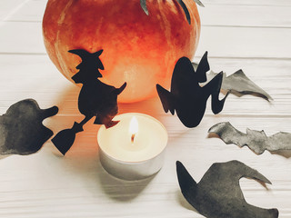 halloween. happy halloween concept. pumpkin with witch ghost bats and spider black decorations on white wooden background. cutouts in light, seasonal greetings, holiday celebration