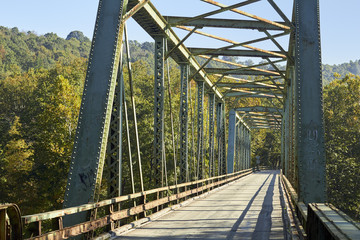 A country road crossing a steel trestle bridge at Perryopolis, Pennsylvania, USA
