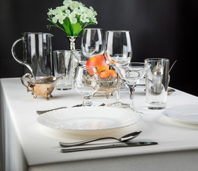 apples on a festive table with glasses and cutlery