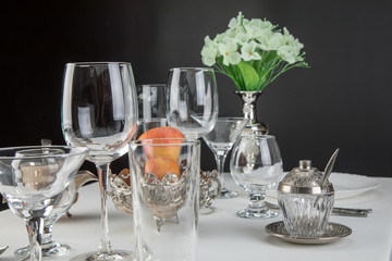 apples on a festive table with glasses and cutlery