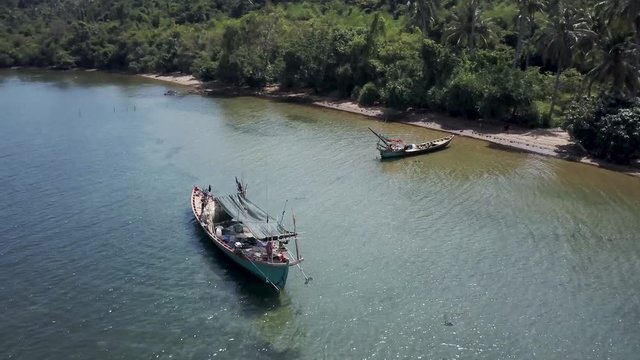 Drone views of a fishing boat on the island of Koh Tonsay, Rabbit Island, Kep Province, Cambodia.