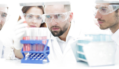 closeup of a group of scientists and pharmacists in the laboratory.