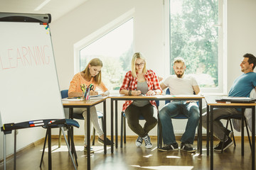Student girl writting Learning word on whiteboard