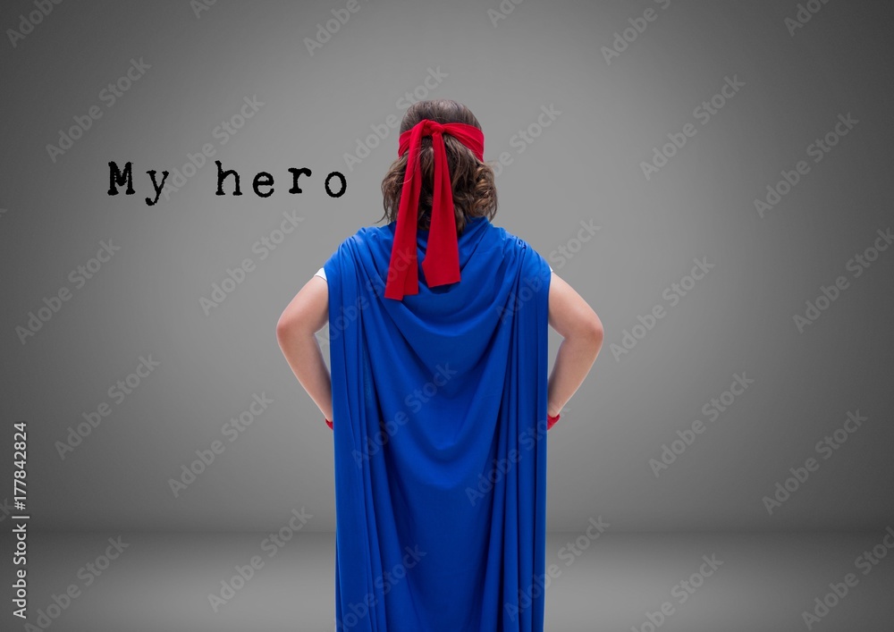 Wall mural Boy against grey background with superhero cloak costume and my