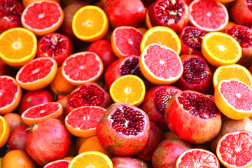 Composition of juicy fruits of pomegranate, orange and grapefruit