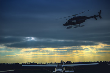 Helicopter flying in the gray sky