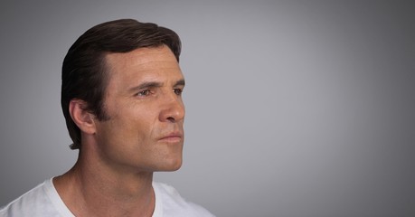 Naklejka premium Man looking contemplatively with grey background