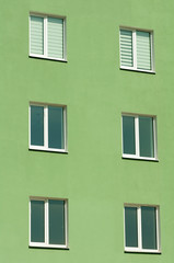 Fototapeta premium six windows on a three-story green house