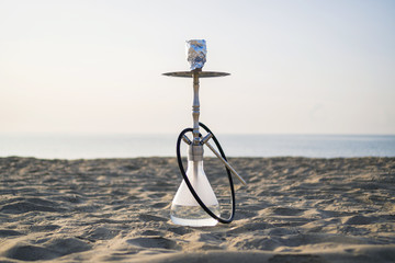 Hookah shisha smoke on beach background