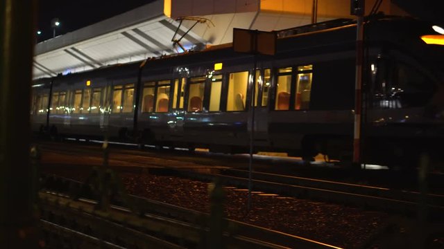 Train arrives at the station at night