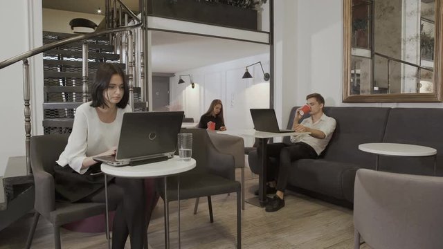 People sit at the table in the co-working space